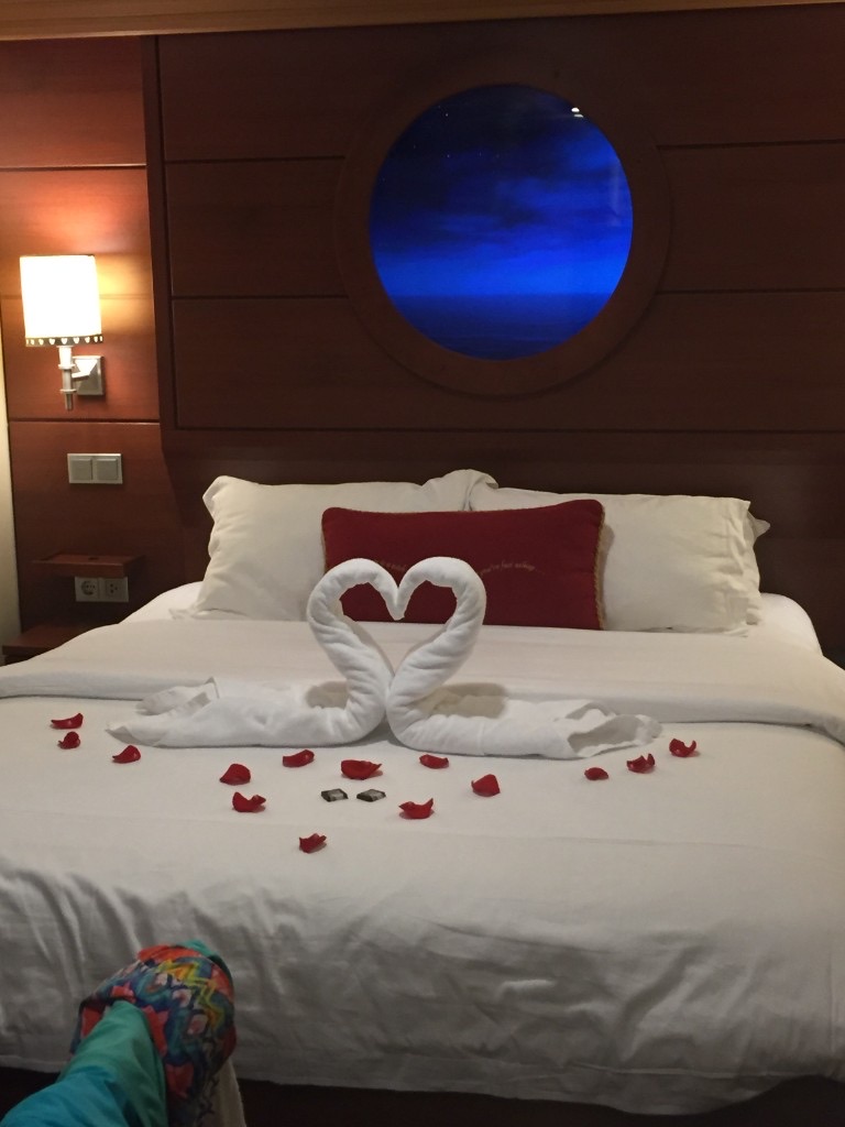 Towel animal swans and Magical Porthole in an inside Disney cruise stateroom