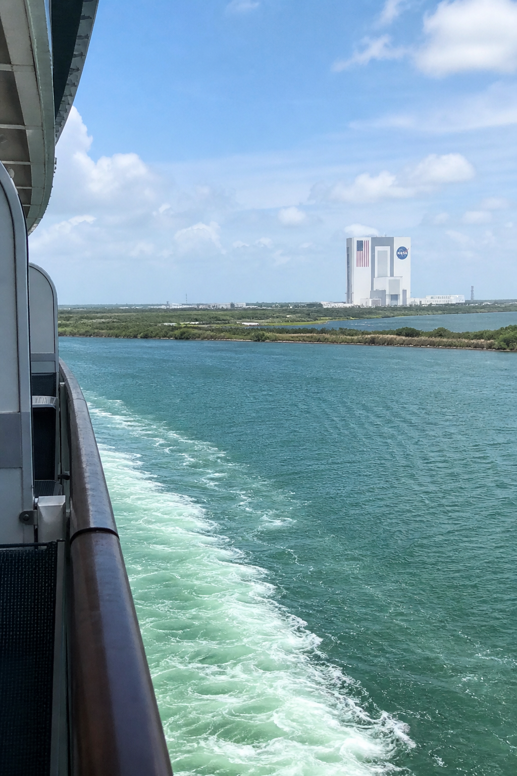 Kennedy Space Center Vehicle Assembly Building seen in the distance from a cruise ship leaving Port Canaveral